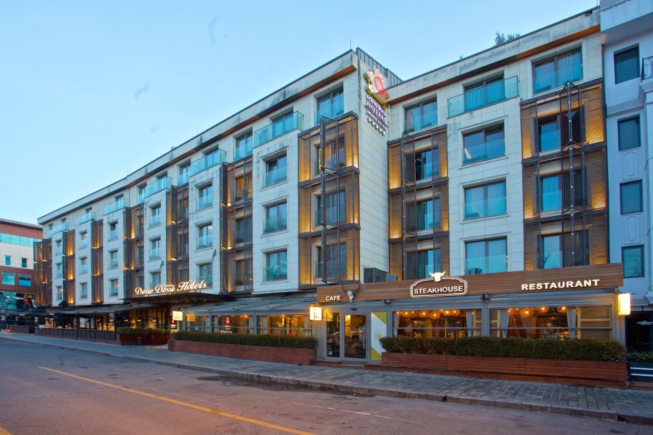 Dosso Dossi Hotels & Spa Downtown Estambul Exterior foto The photo shows a modern hotel building with multiple stories. The façade features a mix of glass and concrete elements, giving it a sleek and contemporary look. There are several large windows across the building, allowing for plenty of natural ligh